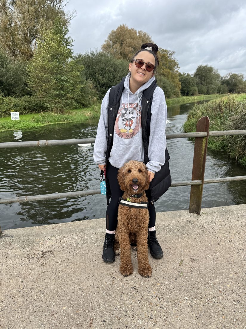 Alethea and her dog by the river